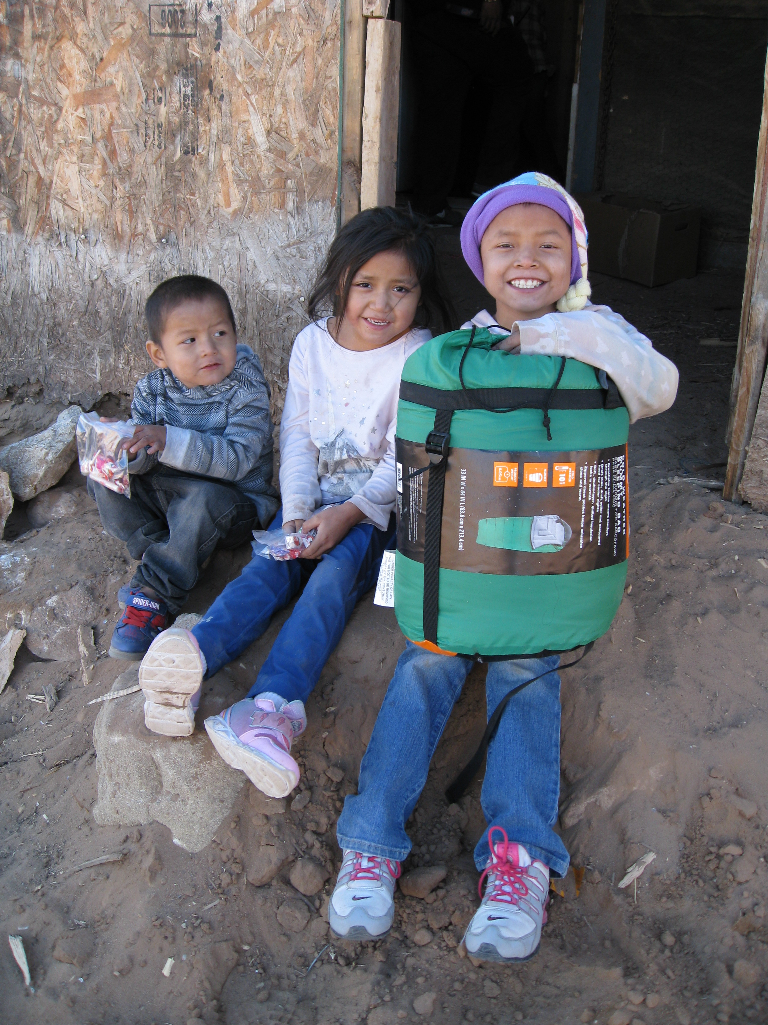 Indian Mobile Mission giving sleeping bags and other items to children