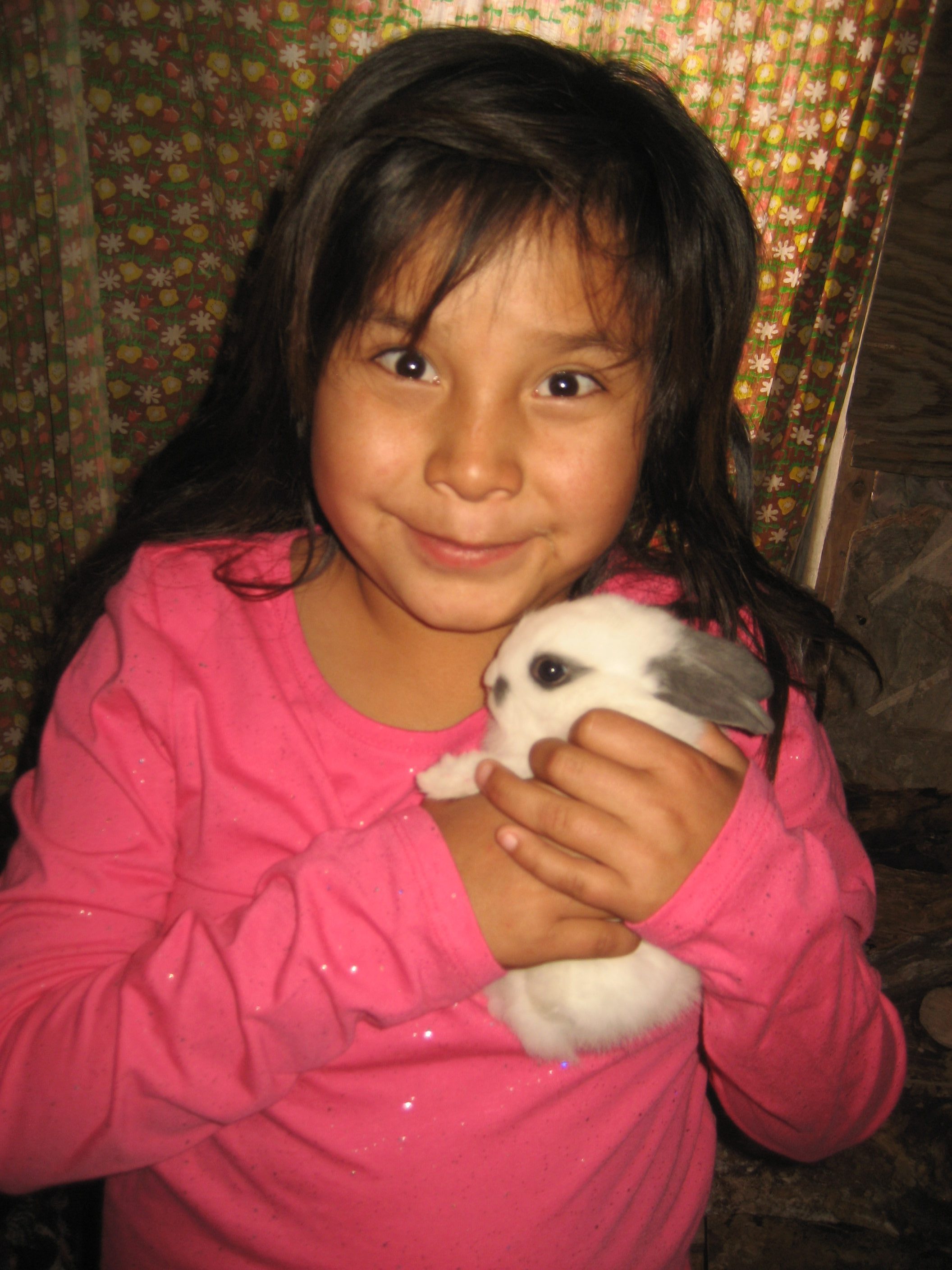 A child holding a bunny