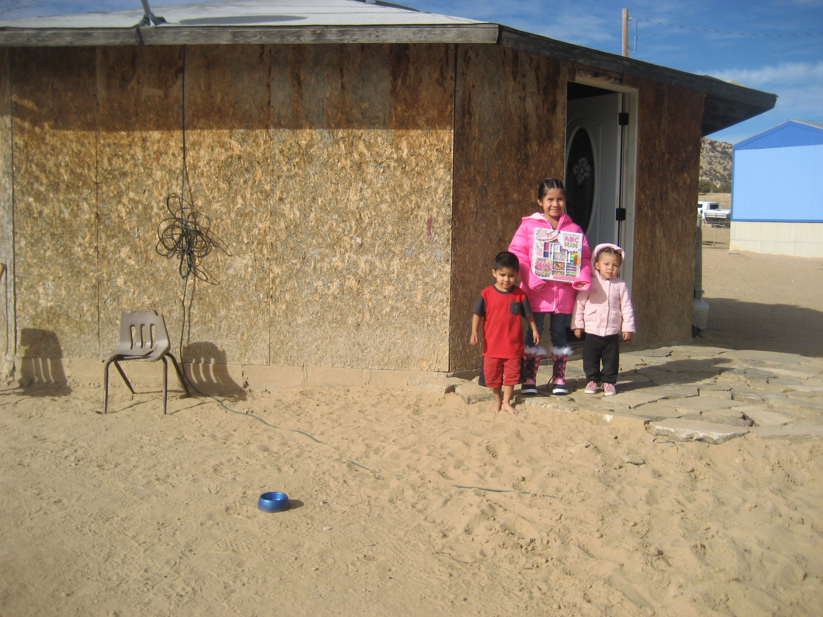 Children outside a home during an Indian Mobile Mission visit