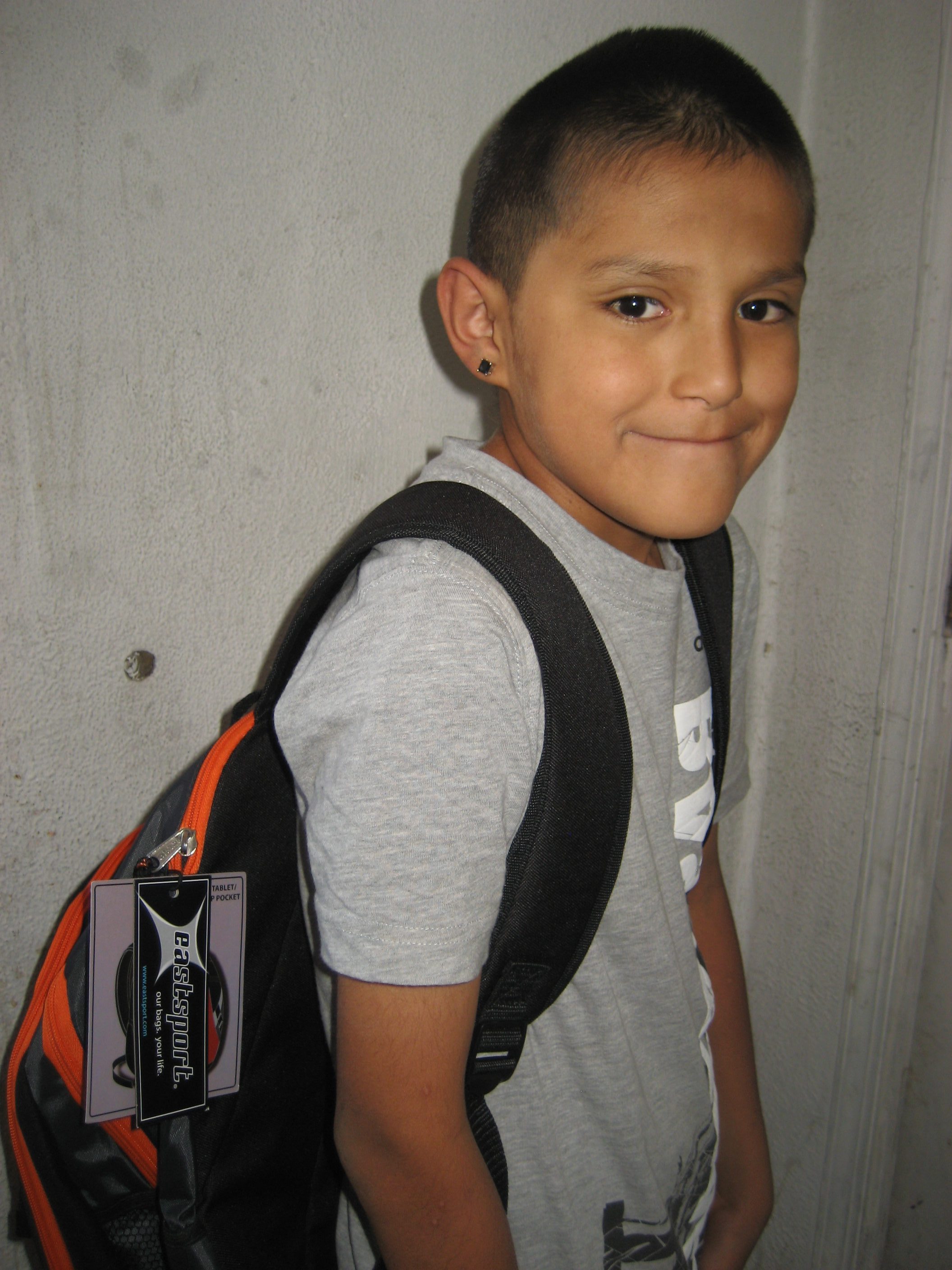A child with a new backpack