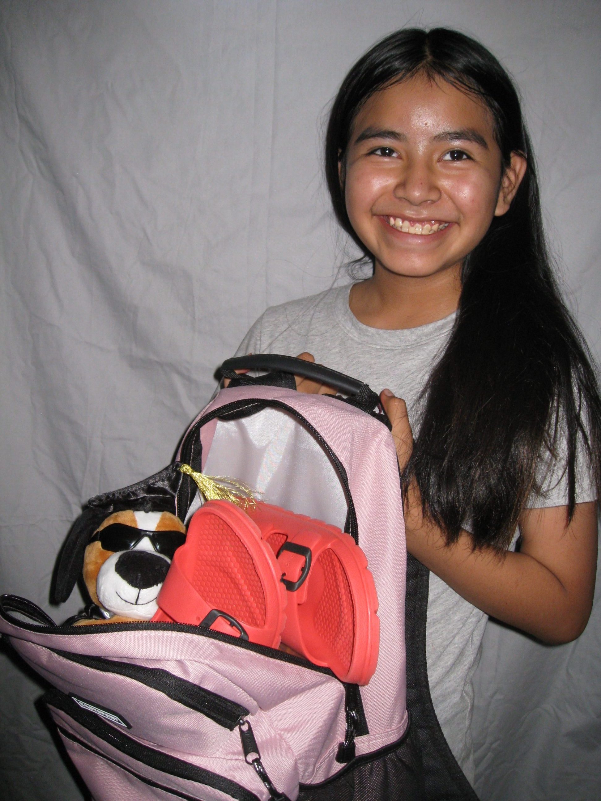 Indian Mobile Mission giving items to a child